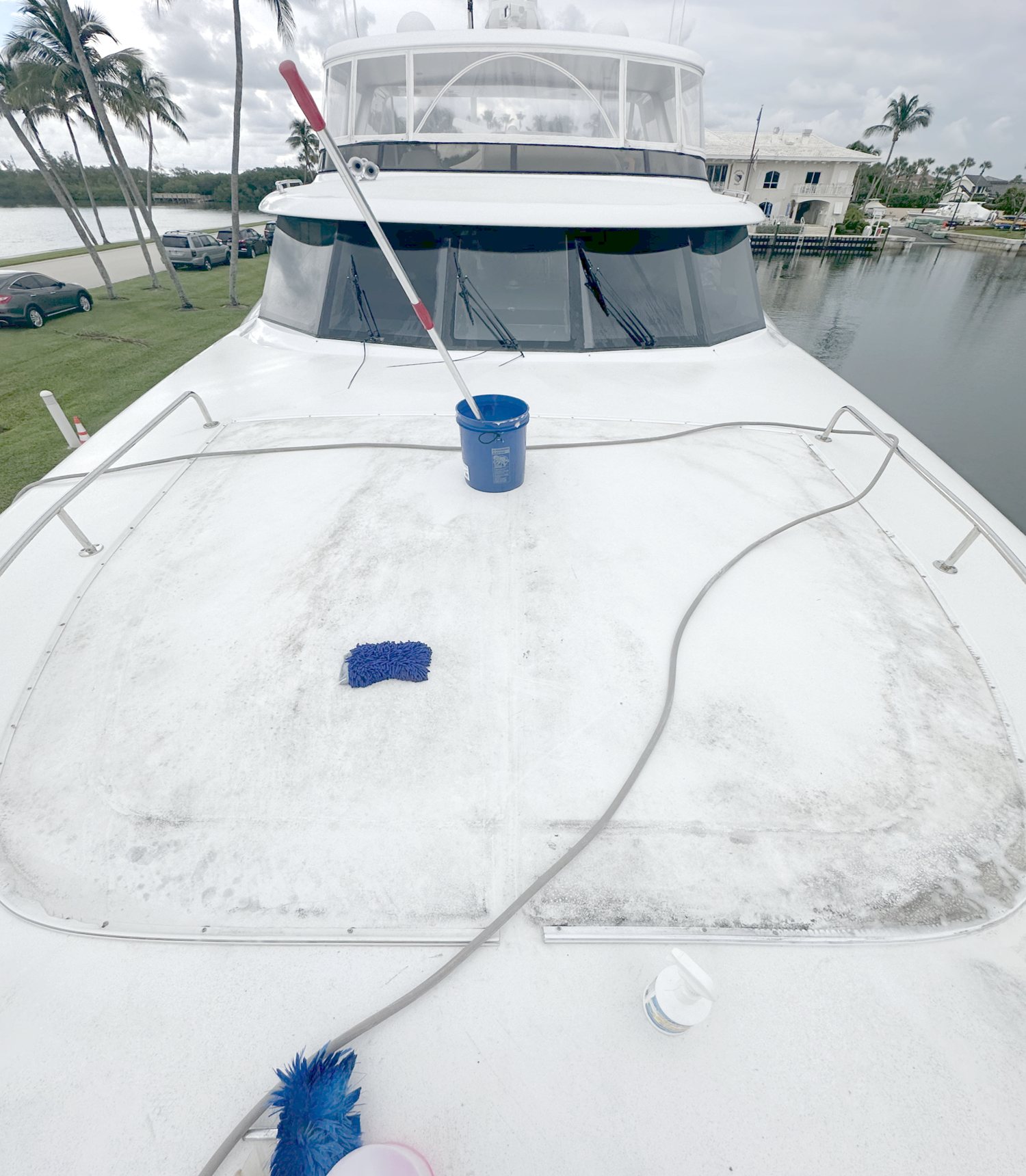 Boat foredeck covered in grime before a wash